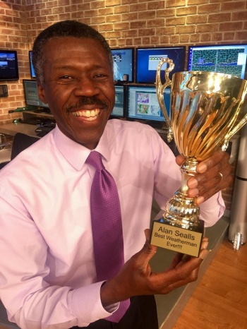 Alan Sealls ’85 holds a trophy