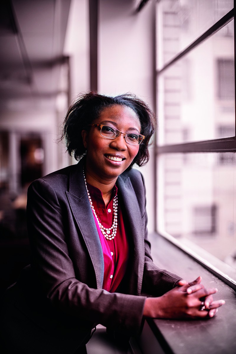 Ludmilla Aristilde stands by a window
