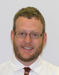 Head shot of Adam Howell