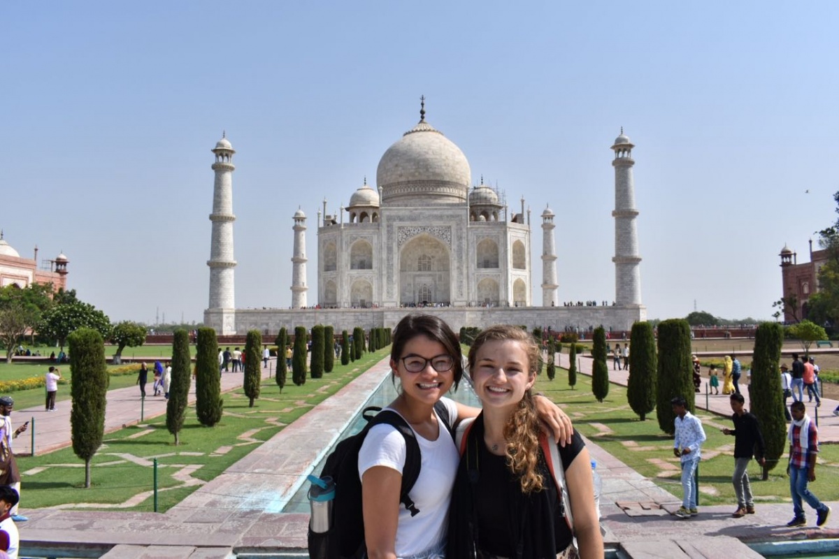 Two students standing in front of Taj Mahal.