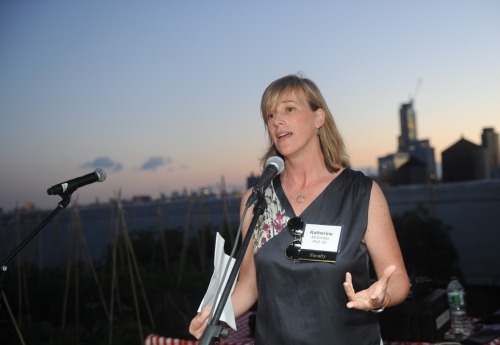 A woman speaking into a microphone