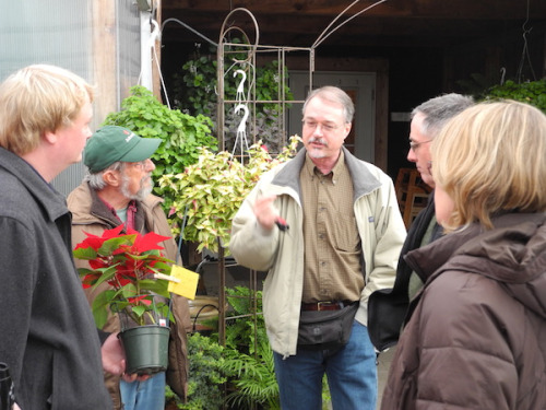 A group of people stands and talks