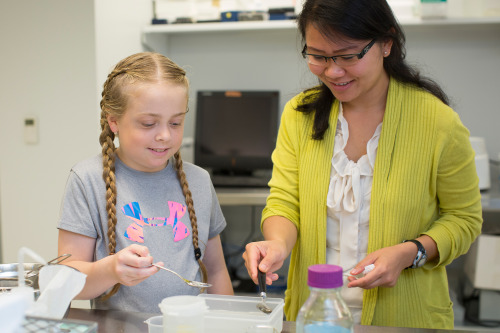 A young girl and a woman make Boba