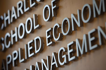 A close up of a sign in the Dyson School