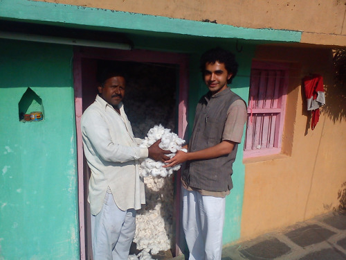Two men holding cotton near Vidarbha, India