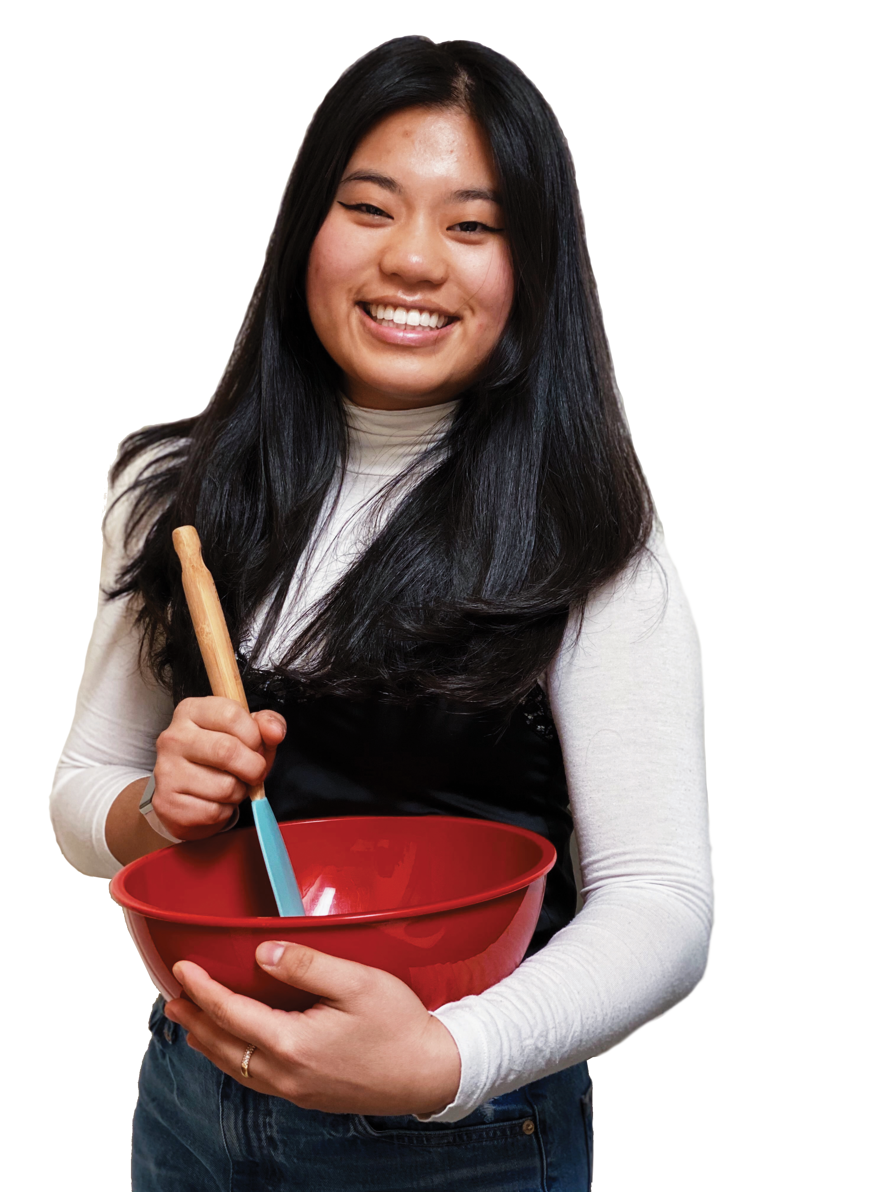 Alex Castroverde holds a mixing bowl and spoon