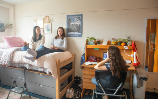 Cornell students sit in a dorm room
