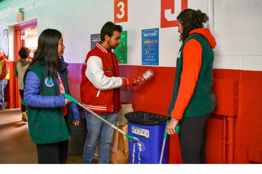 Cornell students recycle at a sports game