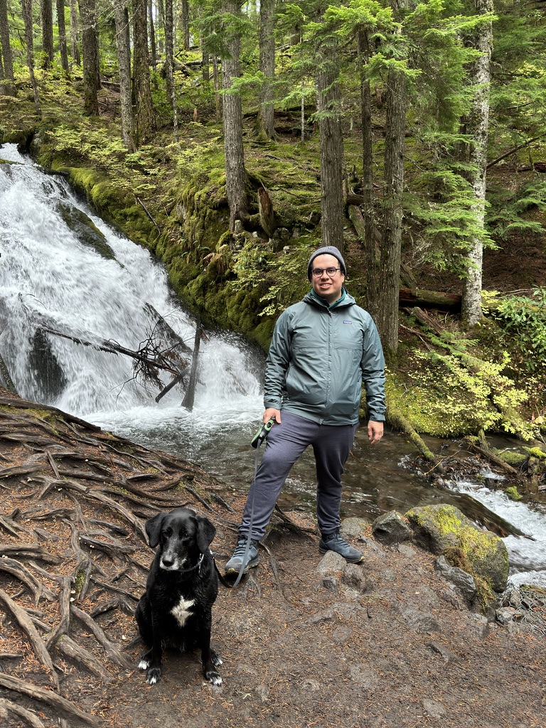 Camilo H. Parada Rojas hiking with dog