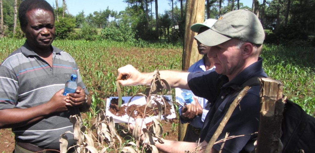Johannes Lehmann speaks with extension officials in western Kenya about soil organic matter