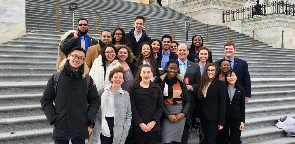 Cornell students stand with U.S. Rep. Tom Reed on the steps of the Capitol building