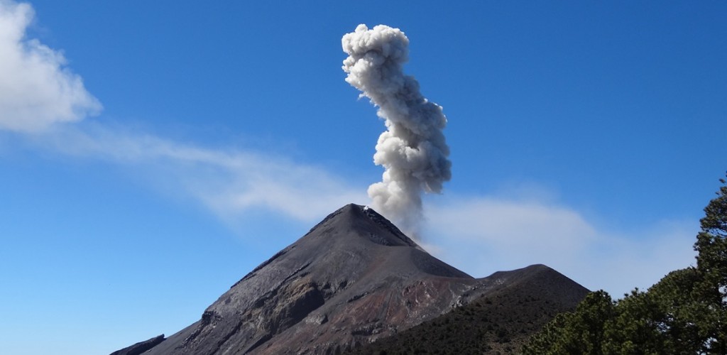 Guatemala’s  Fuego volcano spews an ash column