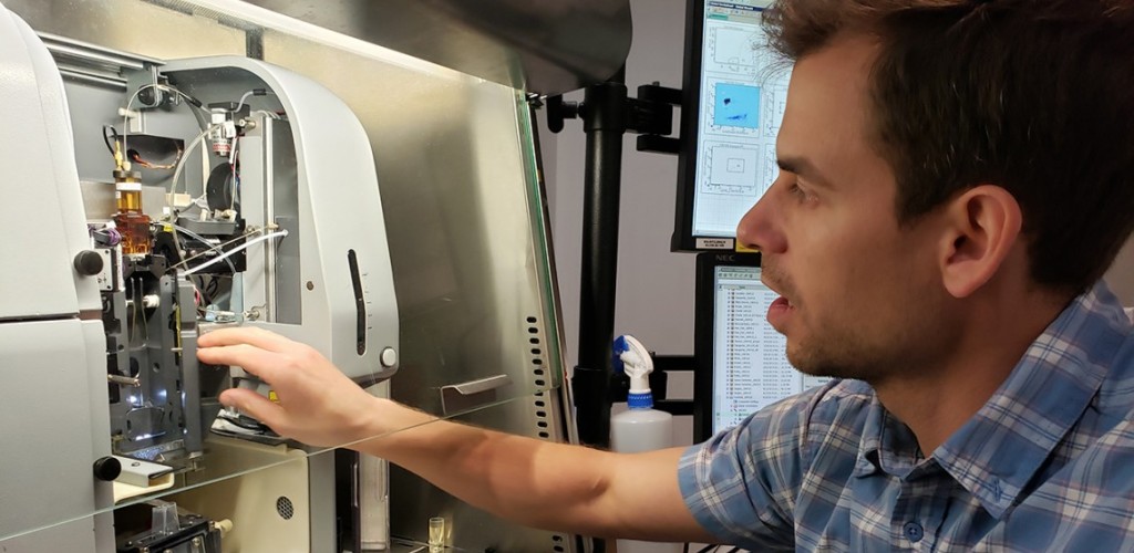 Adam Wojno setting up samples in a cell sorter