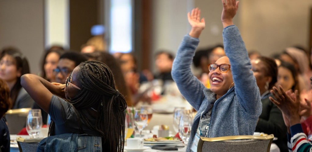 students reacting to speeches with shouts of encouragement