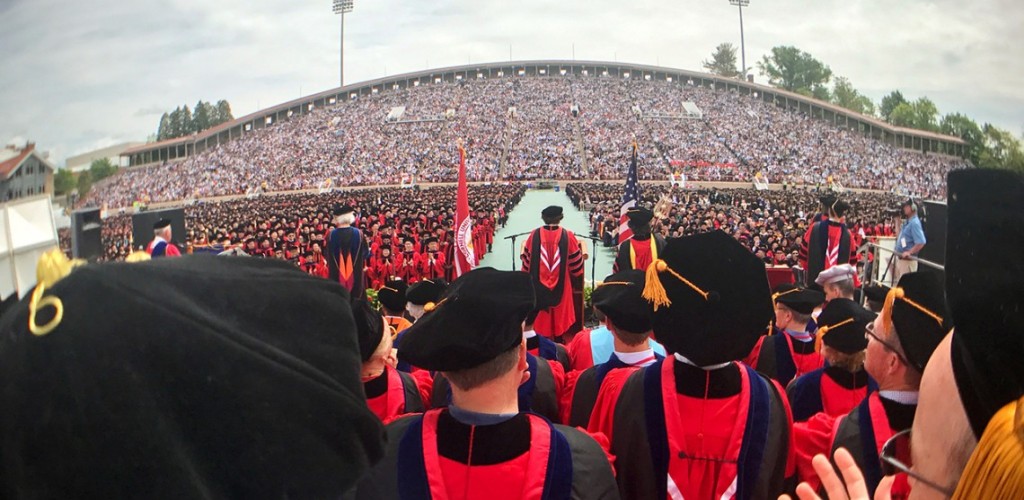 Stadium full of students celebrating graduation