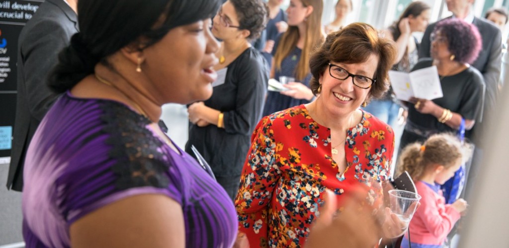 Martha Pollack listens to a student present