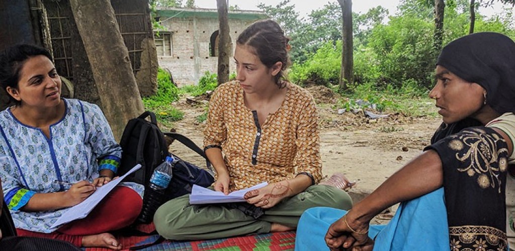 Isabella Culotta sitting outside with Napalese women