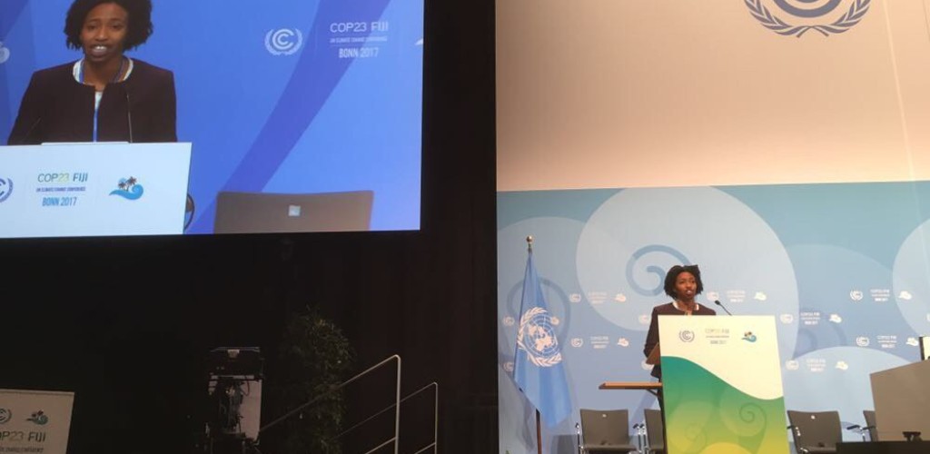 Etinosa Obanor stands at a podium