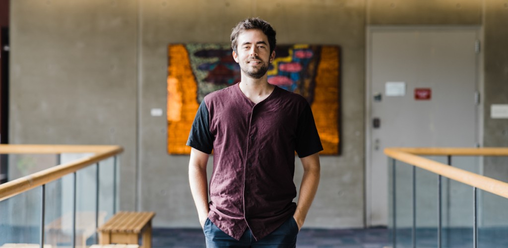 Andrew Moeller standing in a hallway at Corson Hall