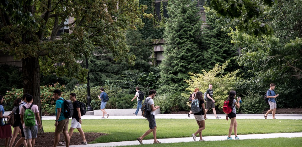 Students walk across quad