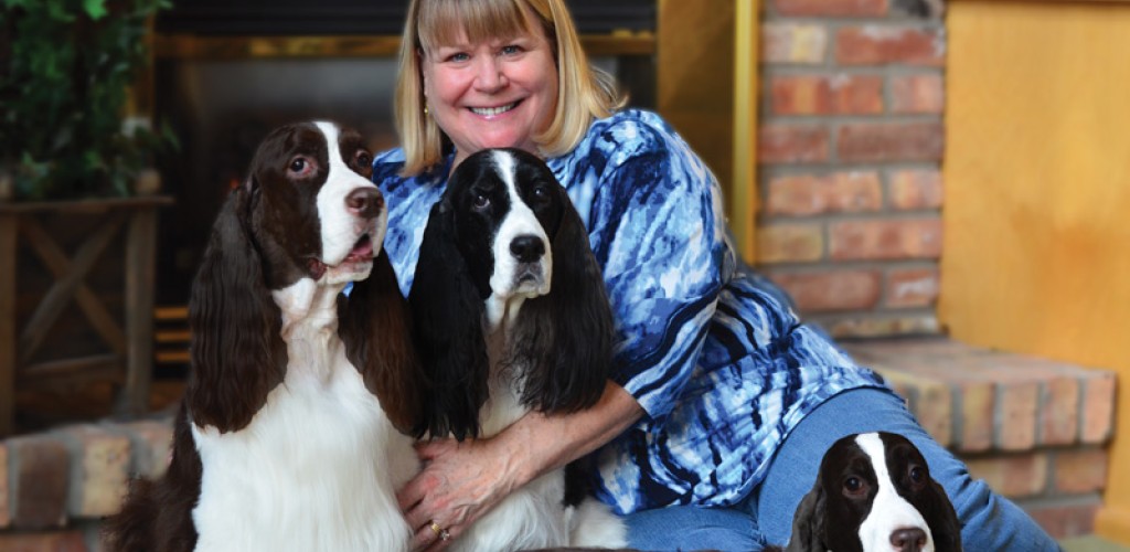 Liz Westring posing with her 3 dogs