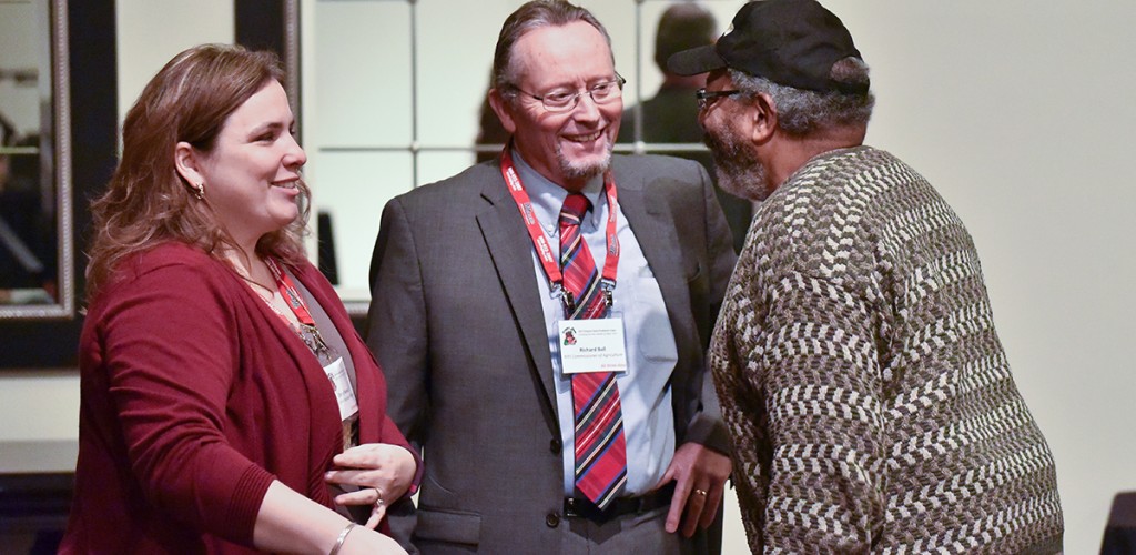 3 people talking and laughing