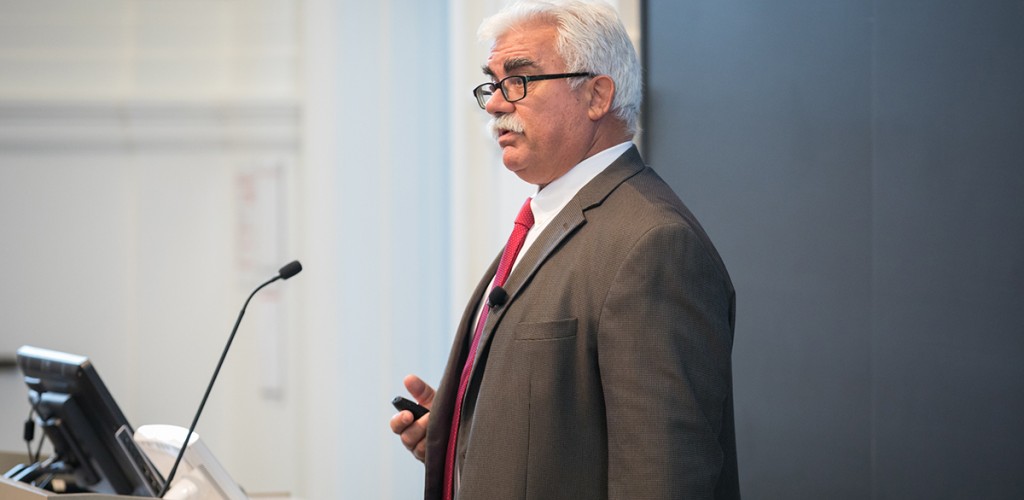 man speaking at podium