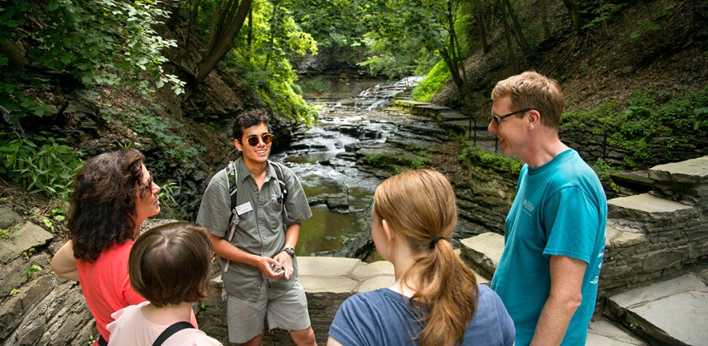 family and steward talk near gorge