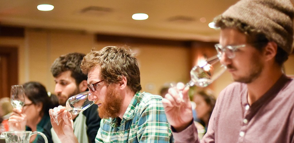 vineyard owners smelling wine