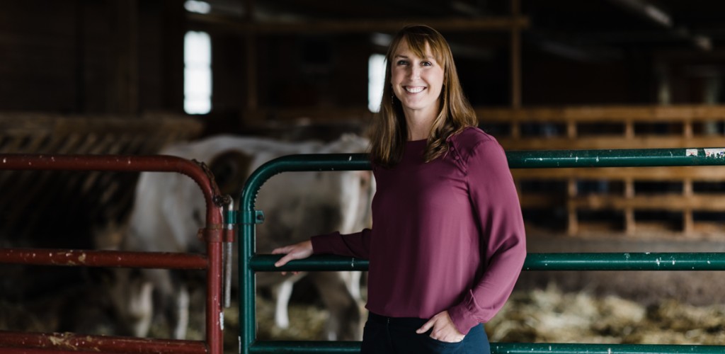 Kristan Reed standing in the cow barn