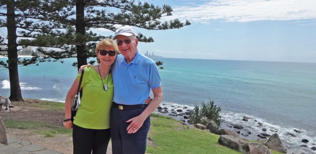 Russ Skelton Jr. and Bonnie Renzi stand in front of the shore