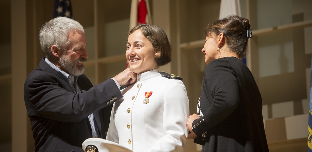 Ensign Courtney McGranaghan with her parents
