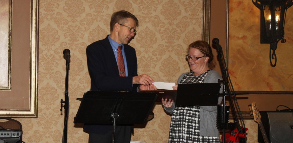 Sarah Lincoln receives an award from Jan Nyrop