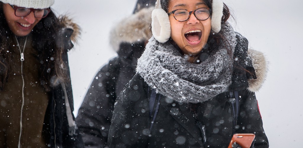 Students walking through snowy quad
