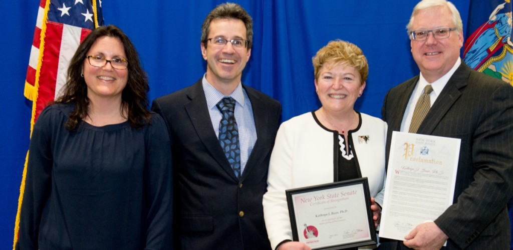 Dean Boor accepting her award on stage