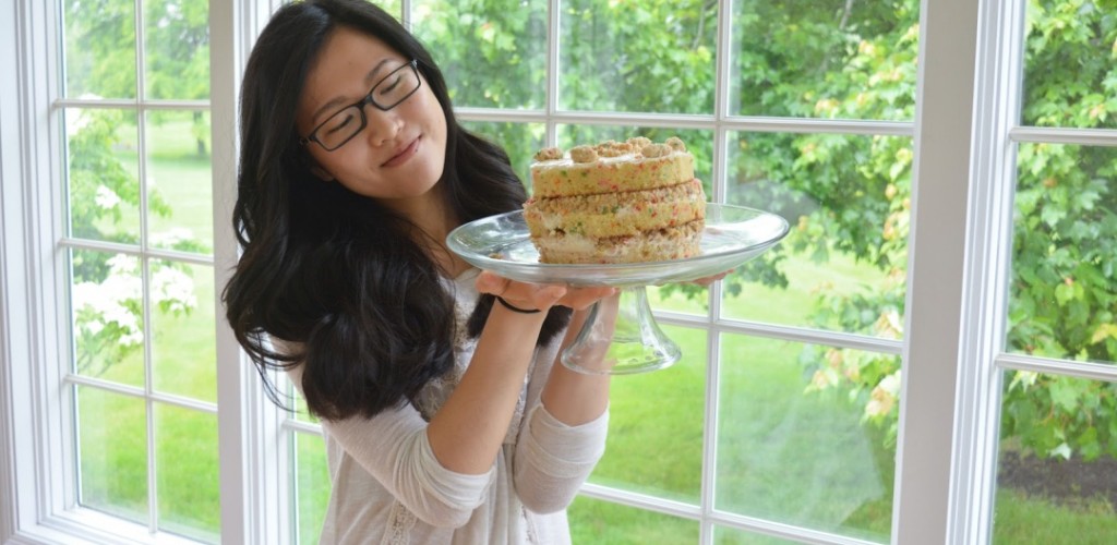 Lady holding up desert treat