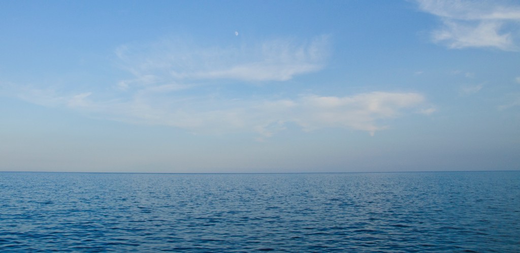 A blue ocean meeting the blue sky