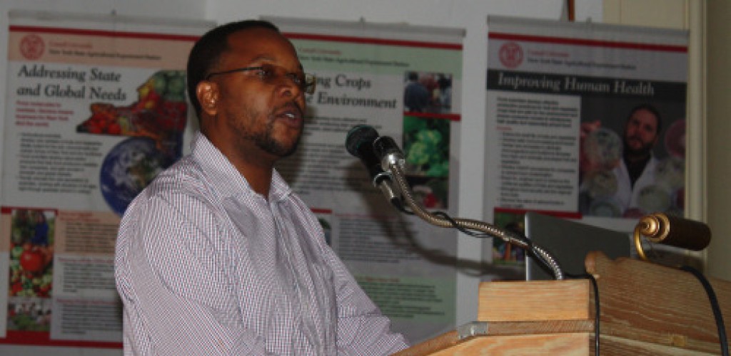 A man stands at a podium and speaks
