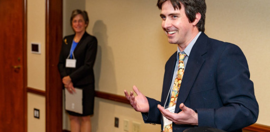A man speaks at an award dinner