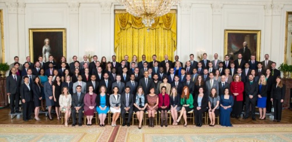 Over 100 people pose for a group photo with President Obama