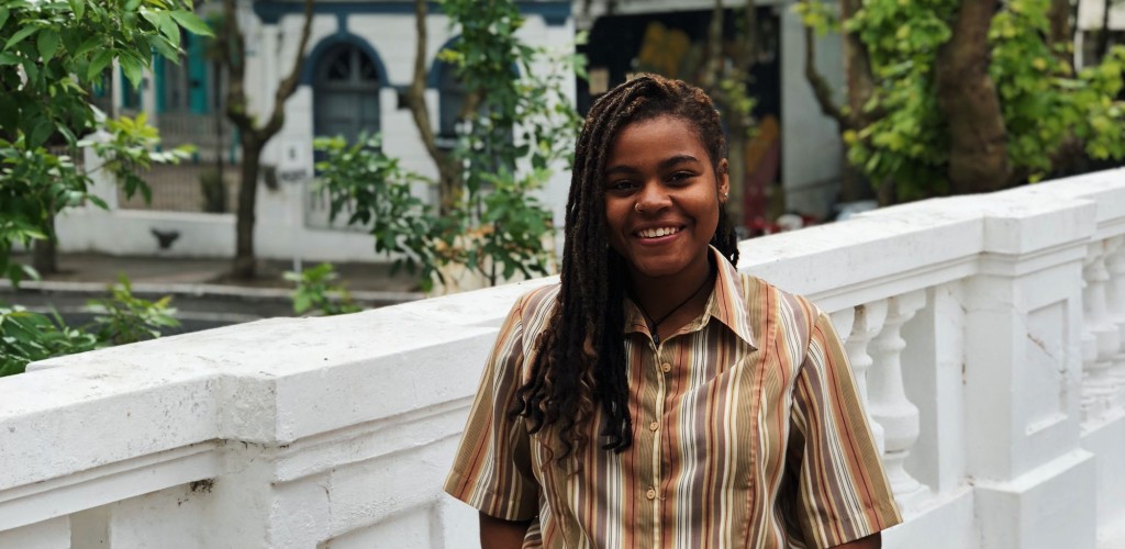 Woman standing on a street with hands in pockets
