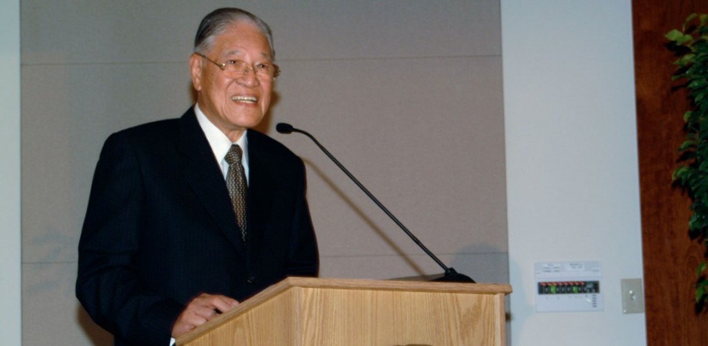 A man standing at a podium and talking