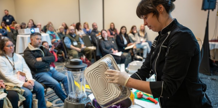 Attendees watch a food preparation presentation at the inaugural New York Farm to School Summit in Syracuse, N.Y.