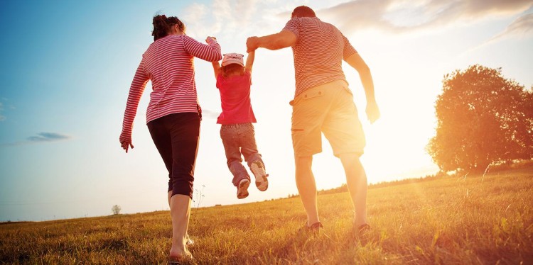 parents holding up their kid