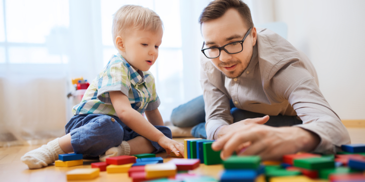 Parent and child playing with bricks