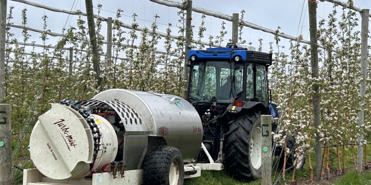 A tractor outfitted with precision cropload management gear. 