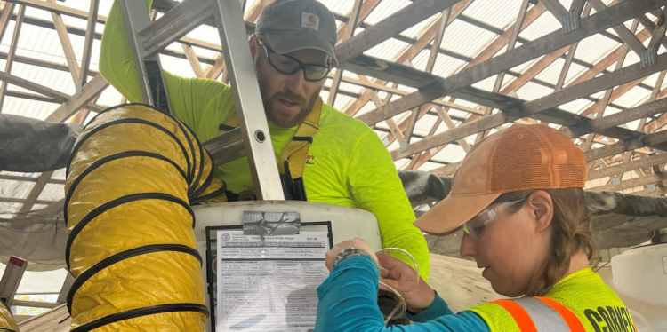 two people perform a manure safety test