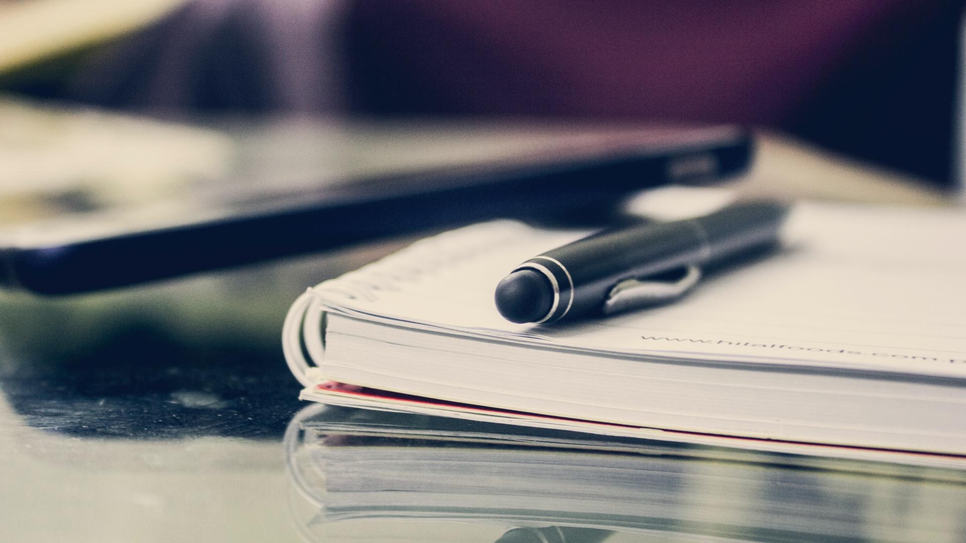 A pen on a notebook