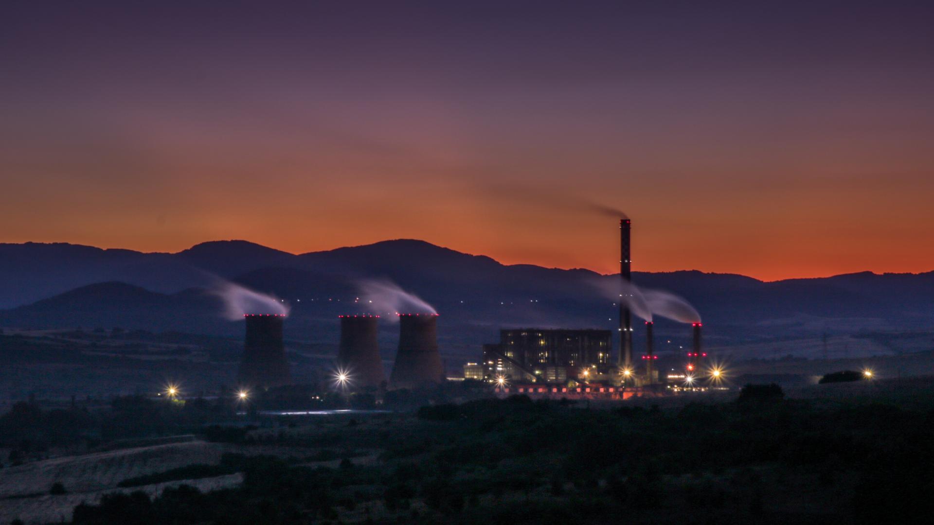 a geothermal power plant at sunset