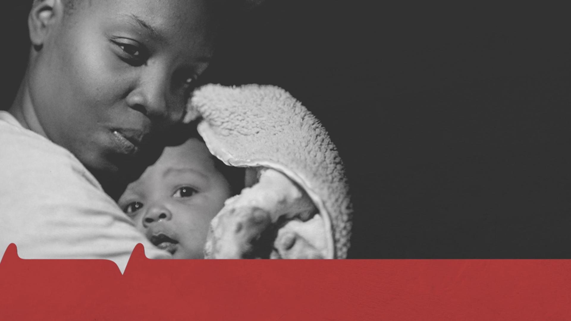 a black mother hugs her child